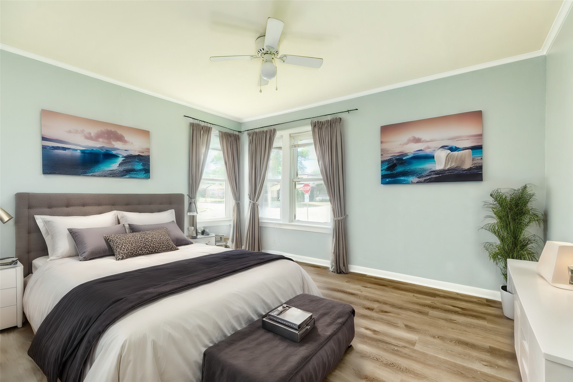 302 West 8th Street, Unit A Freeport, TX 77541 - Photo 14 of 25 a bedroom with a bed and a painting on the wall