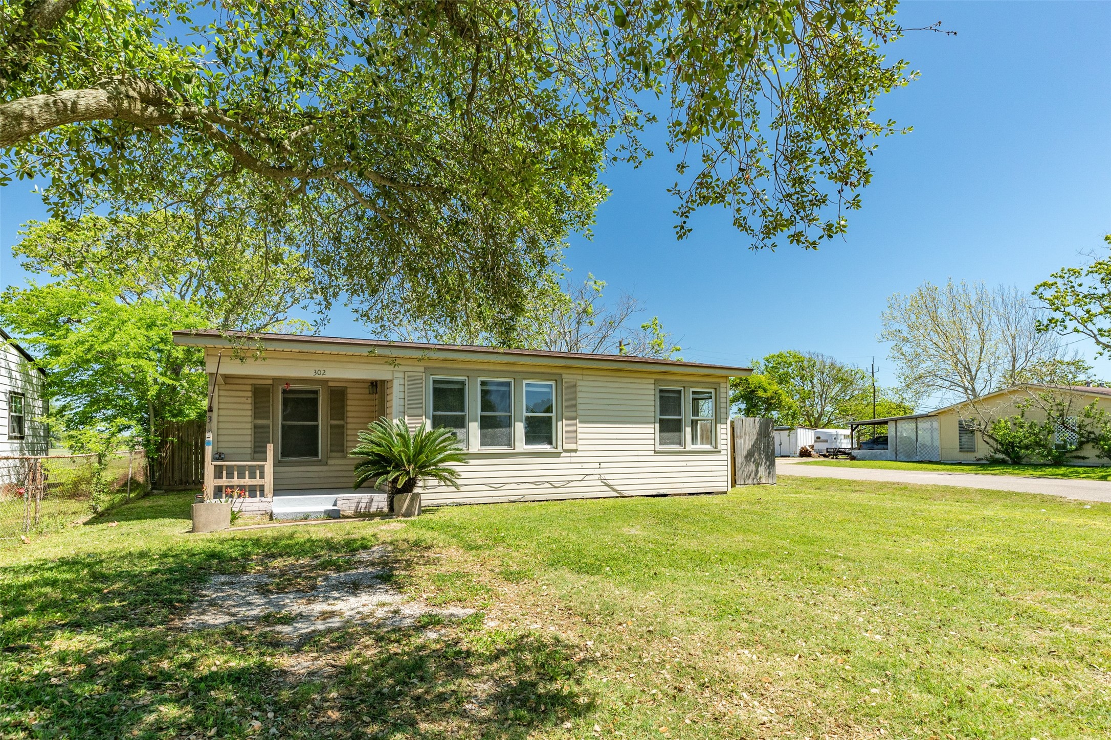 302 West 8th Street, Unit A Freeport, TX 77541 - Photo 17 of 25 a front view of house with yard and green space