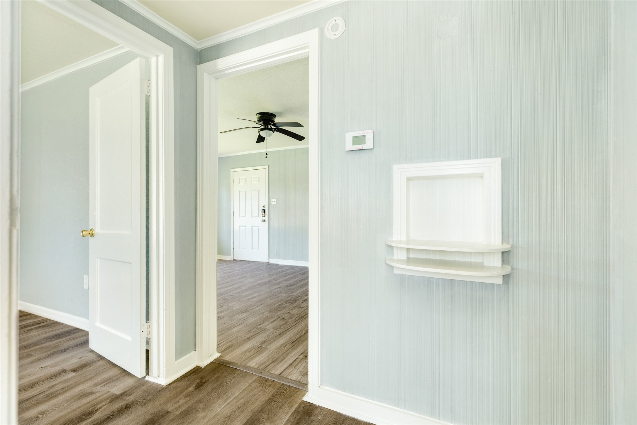 302 West 8th Street, Unit A Freeport, TX 77541 - Photo 19 of 25 a view of a hallway with wooden floor and closet