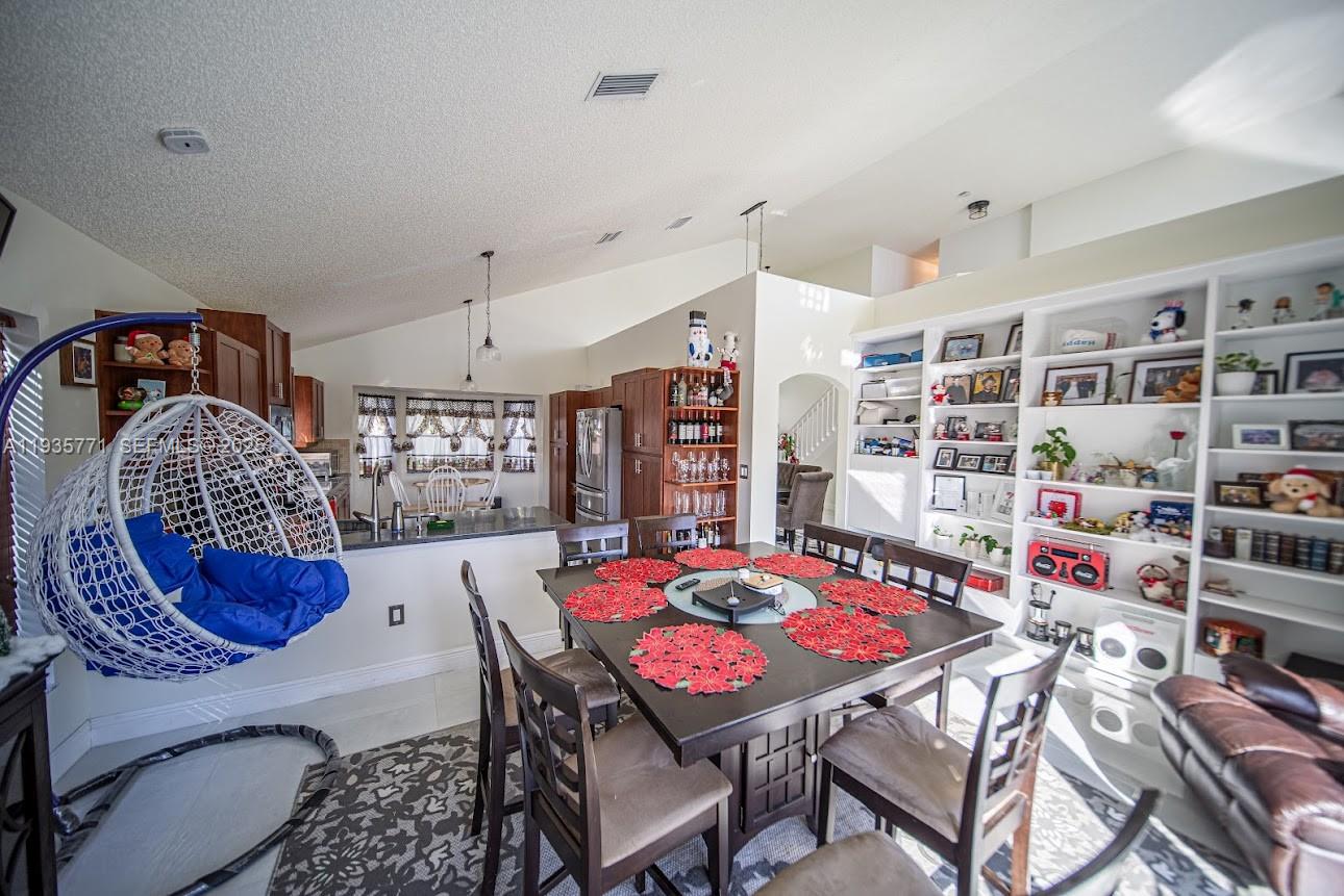 13020 Southwest 17th Court Miramar, FL 33027 - Photo 41 of 78 a view of a dining room with furniture