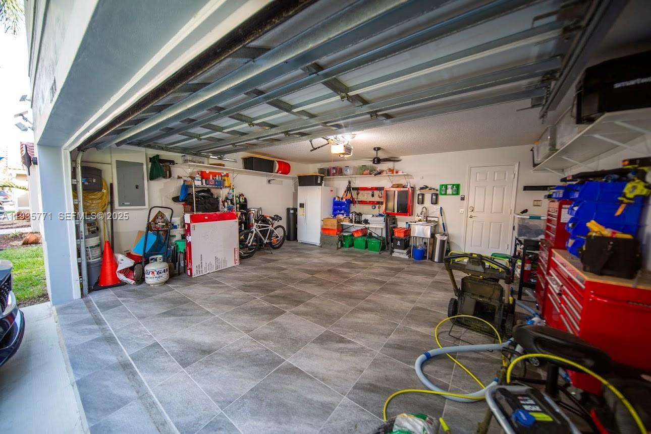 13020 Southwest 17th Court Miramar, FL 33027 - Photo 53 of 78 a view of a garage with a bike and car