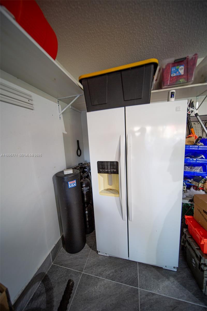 13020 Southwest 17th Court Miramar, FL 33027 - Photo 54 of 78 a view of storage and utility room with washer and dryer