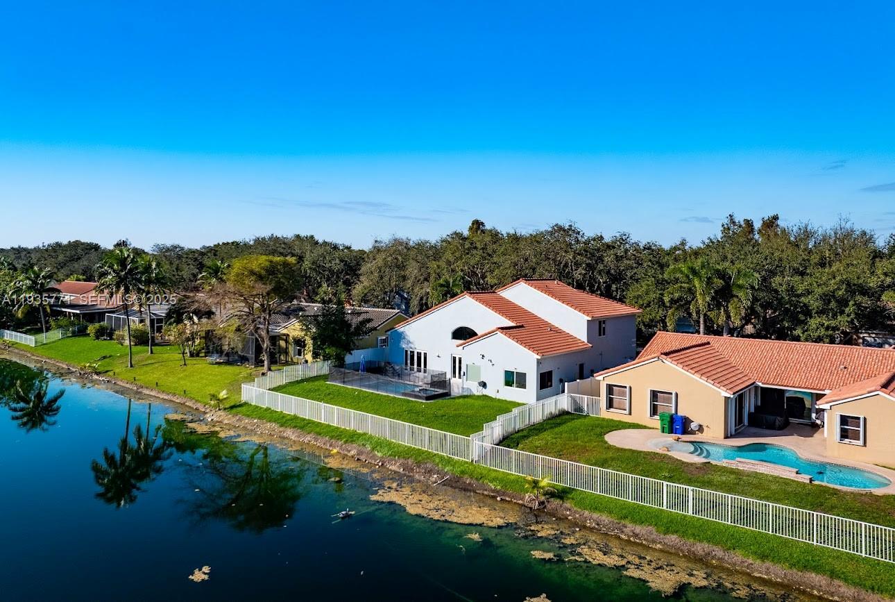 13020 Southwest 17th Court Miramar, FL 33027 - Photo 60 of 78 an aerial view of residential houses with outdoor space and trees