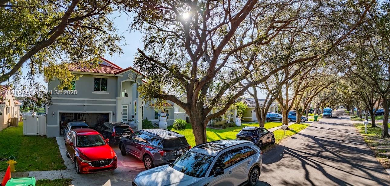 13020 Southwest 17th Court Miramar, FL 33027 - Photo 69 of 78 a view of a swimming pool with lawn chairs and a fire pit