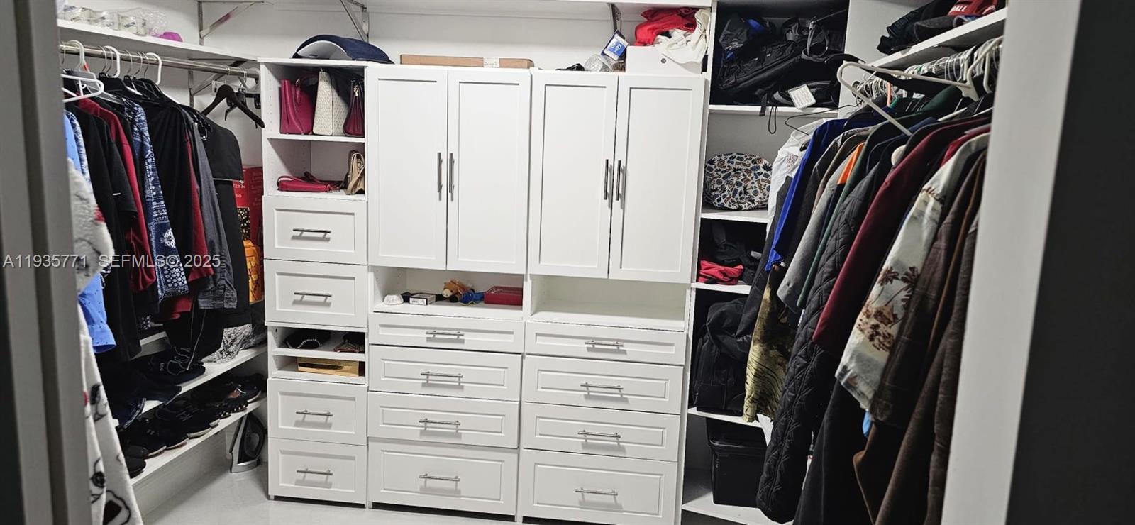 13020 Southwest 17th Court Miramar, FL 33027 - Photo 71 of 78 a view of walk in closet with clothes and shoes