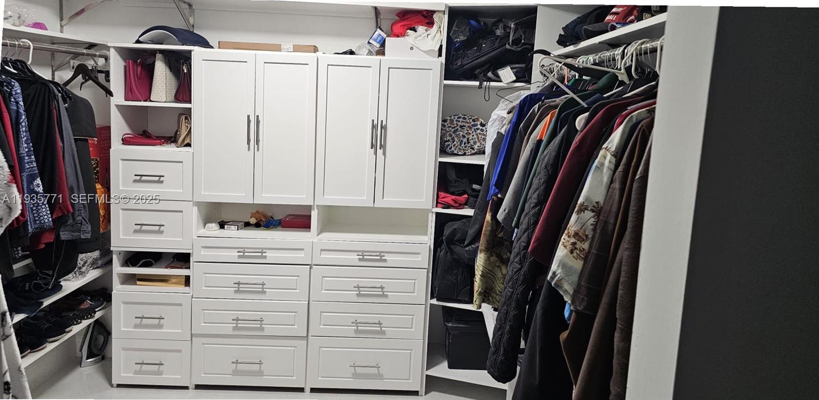 13020 Southwest 17th Court Miramar, FL 33027 - Photo 73 of 78 a view of walk in closet with clothes and shoes