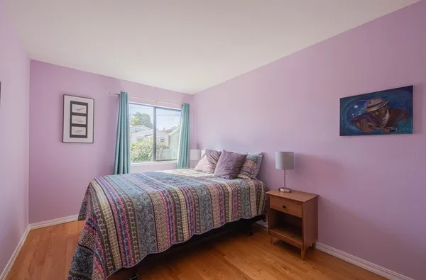 a bedroom with a bed and a closet