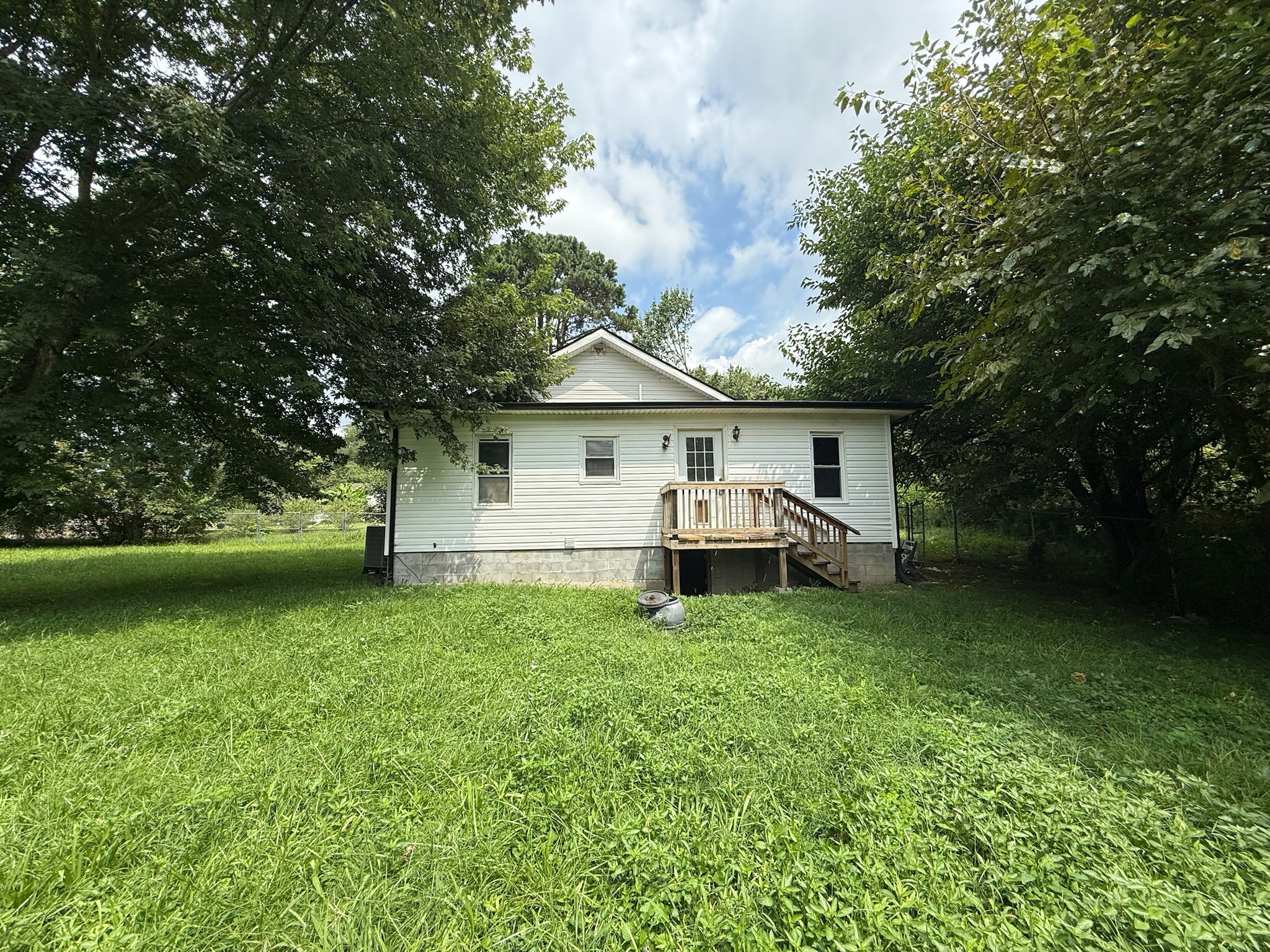 63 West Greendale Street Corbin, KY 40701 - Photo 17 of 24 a view of a house with a yard and sitting area