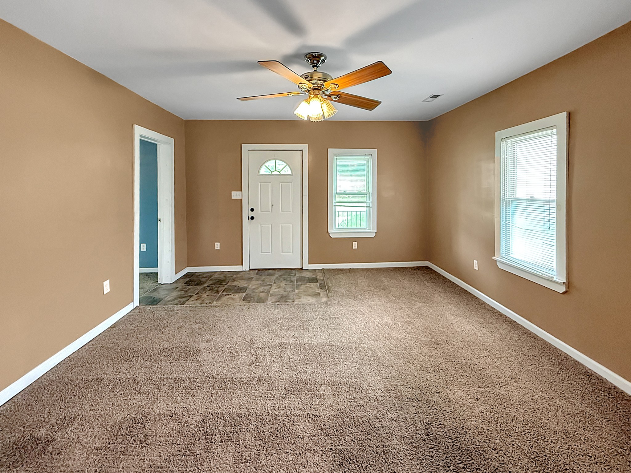 63 West Greendale Street Corbin, KY 40701 - Photo 3 of 24 wooden floor in an empty room with a window