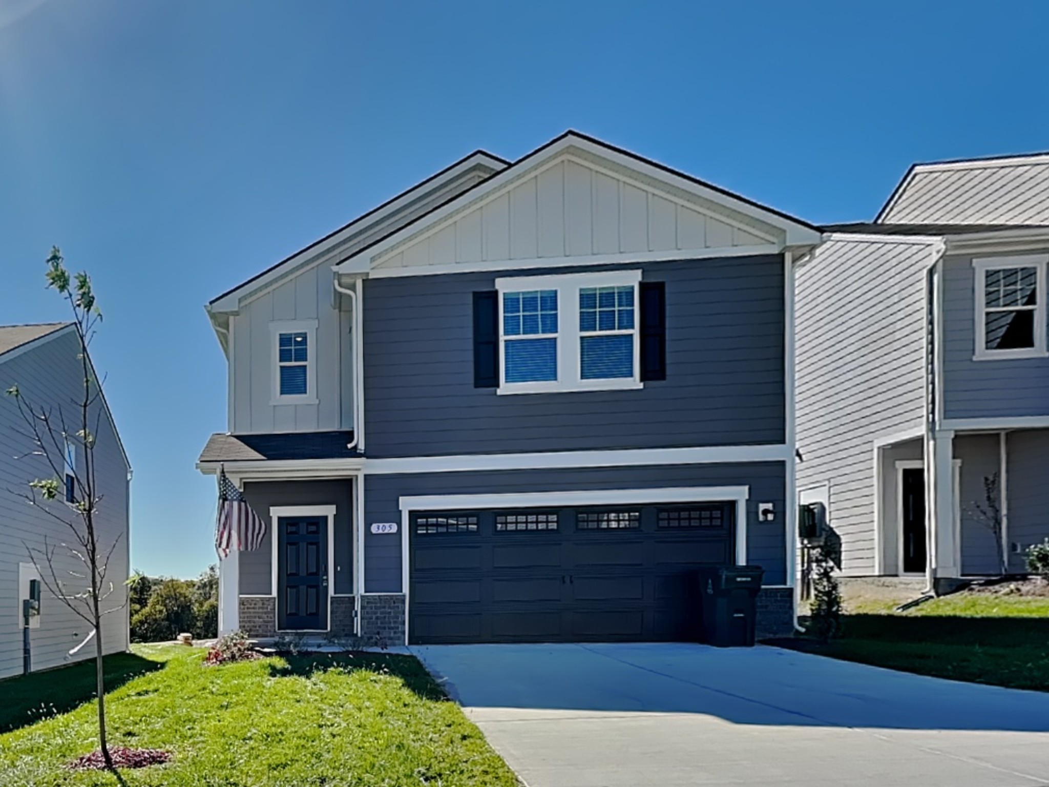 305 Nasturtium Way La Vergne, TN 37086 - Photo 1 of 22 a front view of a house with garden