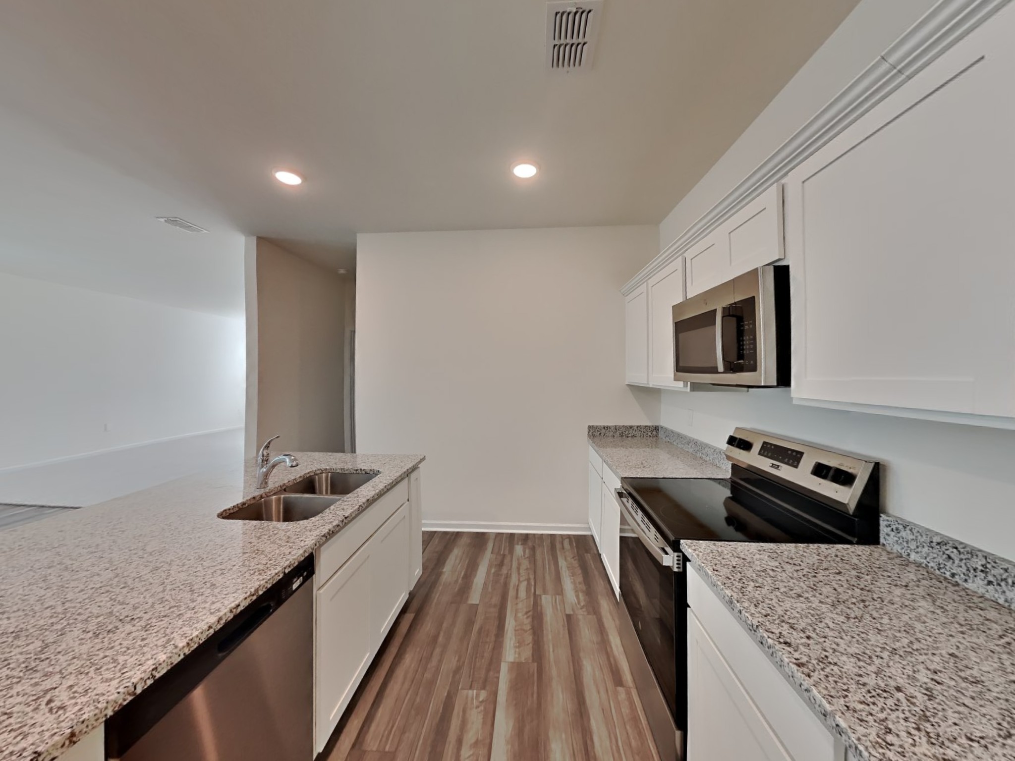 305 Nasturtium Way La Vergne, TN 37086 - Photo 5 of 22 a kitchen with a stove and a sink