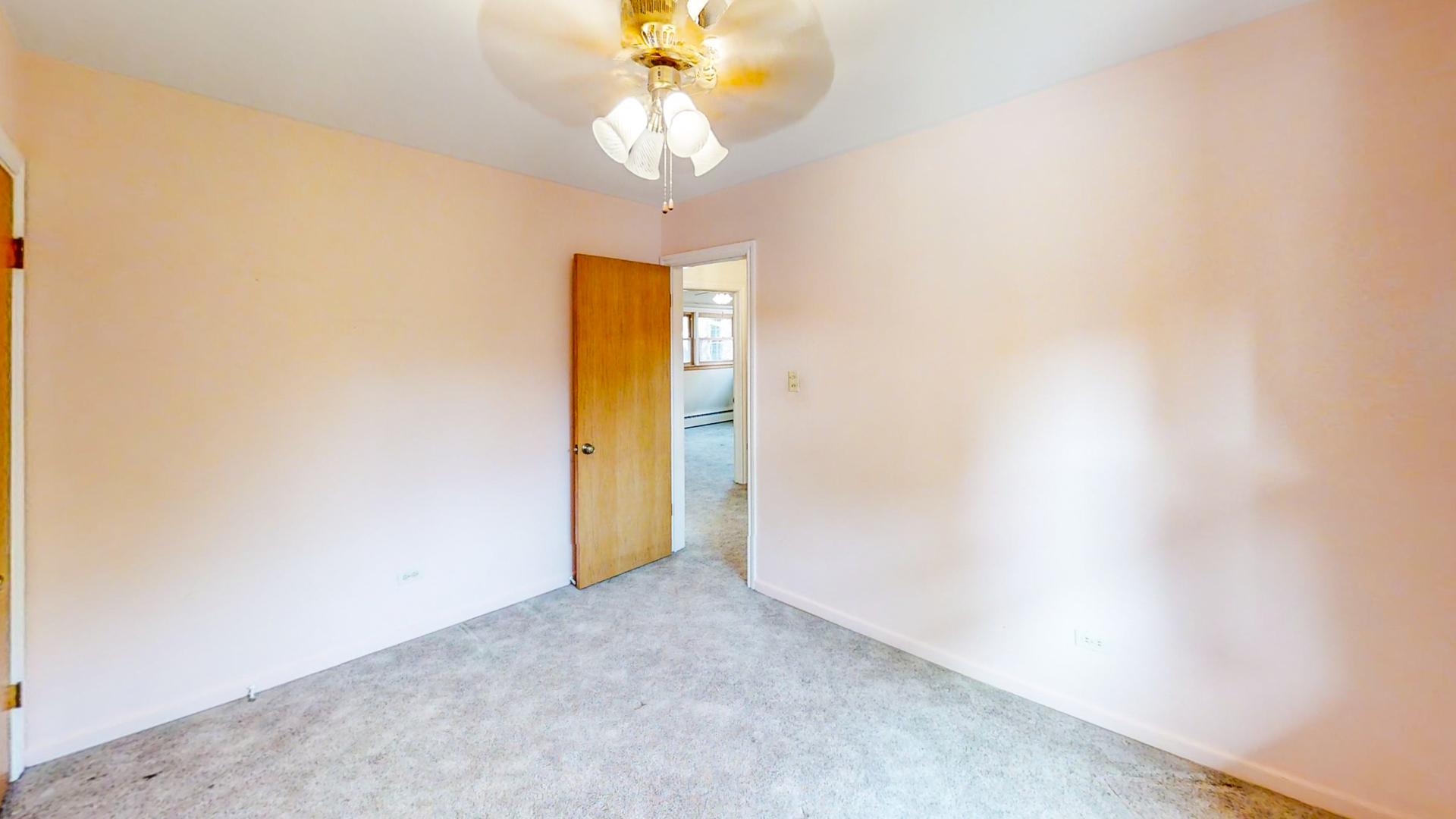 1933 South Crescent Avenue Park Ridge, IL 60068 - Photo 13 of 23 an empty room with a chandelier fan and a window