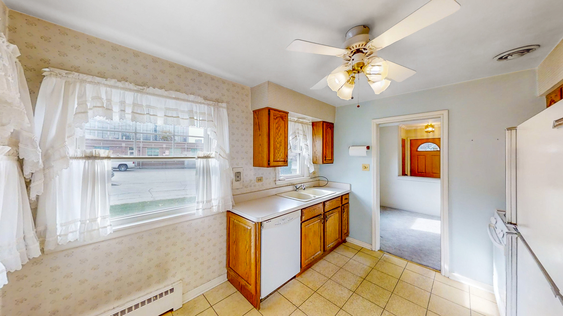 1933 South Crescent Avenue Park Ridge, IL 60068 - Photo 6 of 23 a kitchen with stainless steel appliances granite countertop a stove a sink and a refrigerator