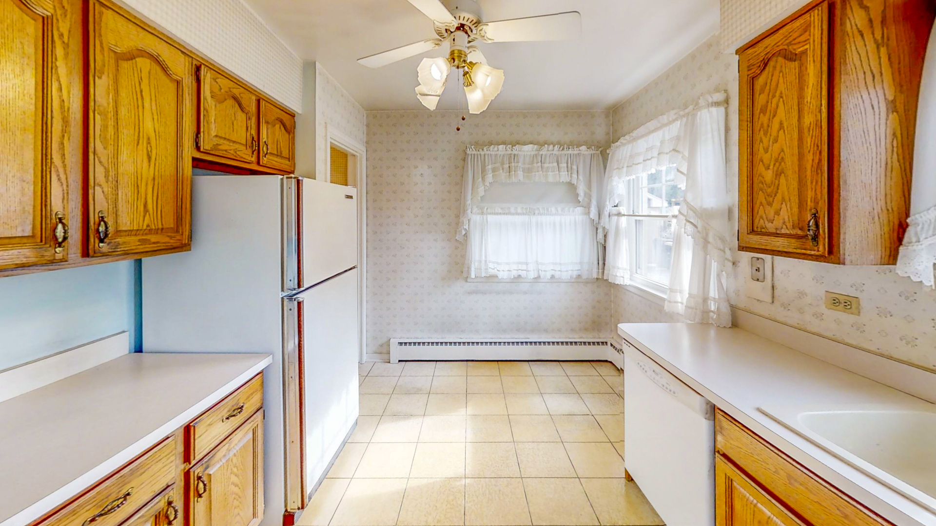 1933 South Crescent Avenue Park Ridge, IL 60068 - Photo 8 of 23 a kitchen with a sink a refrigerator and cabinets