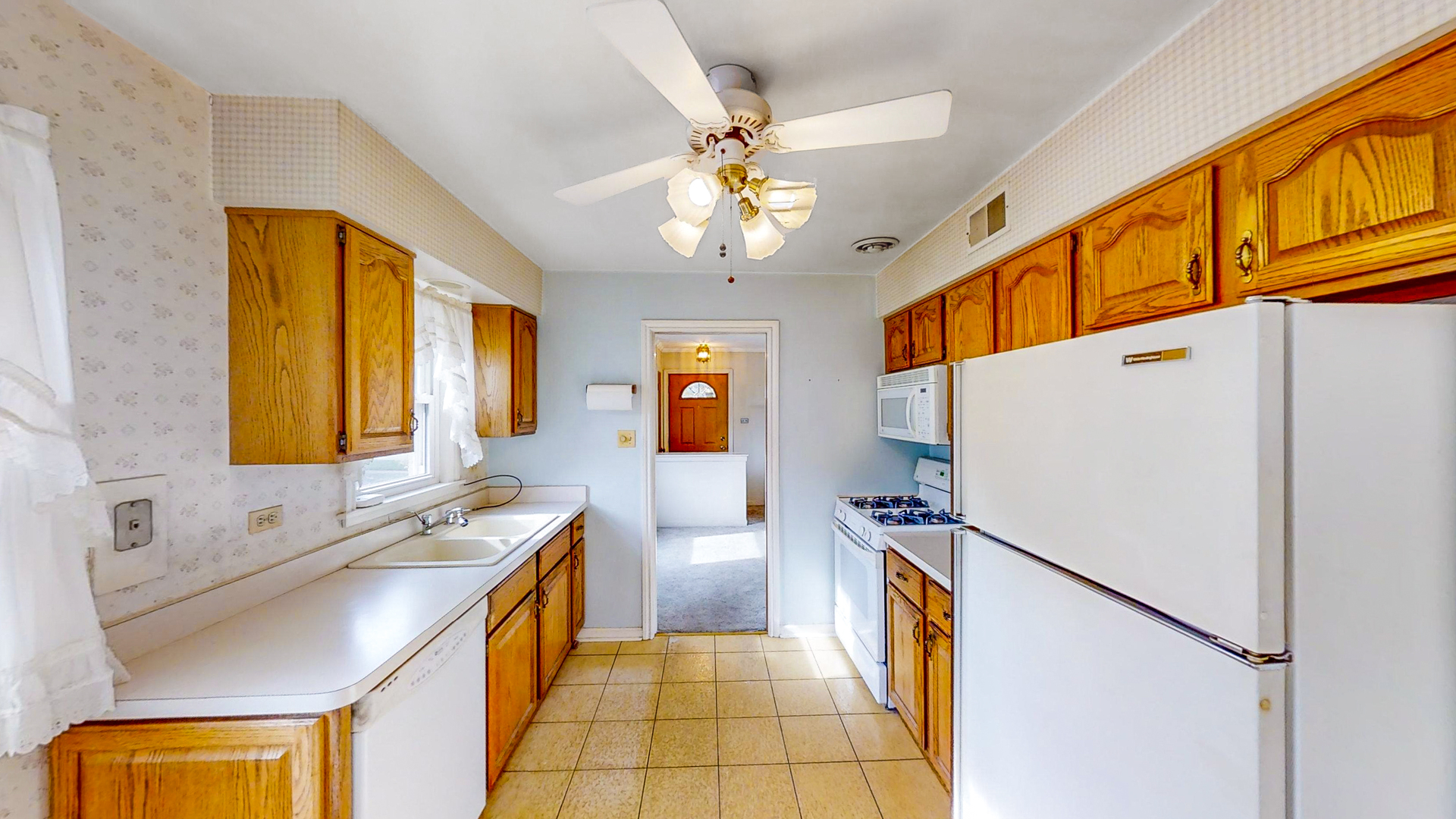 1933 South Crescent Avenue Park Ridge, IL 60068 - Photo 9 of 23 a kitchen with stainless steel appliances granite countertop a refrigerator a stove and a sink