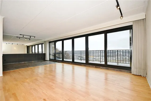 a view of an empty room with a window