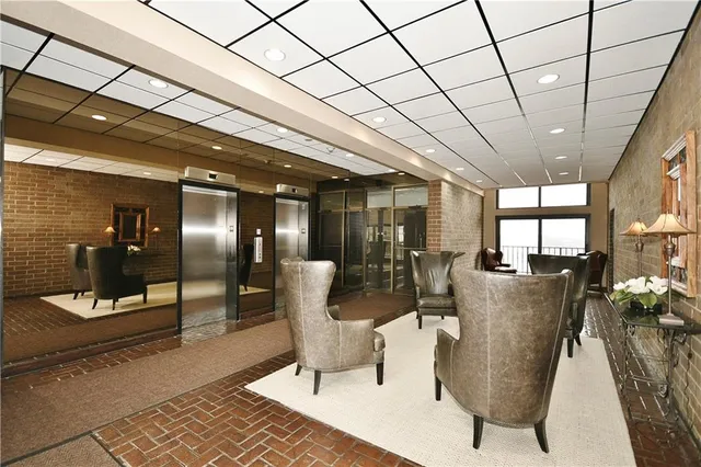 a lobby with furniture and window