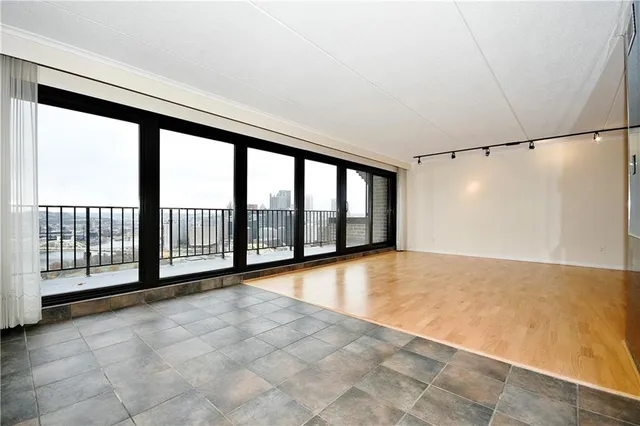 a view of an empty room with a balcony