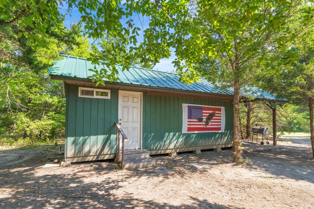 1578 Campground Road Sherman, TX 75090 - Photo 5 of 18 a house with sign broad in front of it
