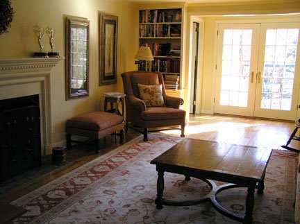Undisclosed Address Riverside, CT 06878 - Photo 2 of 7 a living room with furniture and a fireplace