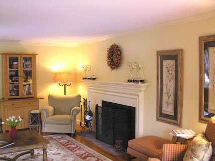 Undisclosed Address Riverside, CT 06878 - Photo 3 of 7 a living room with furniture and a fireplace