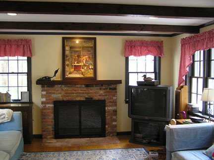 Undisclosed Address Riverside, CT 06878 - Photo 5 of 7 a living room with furniture and a fireplace