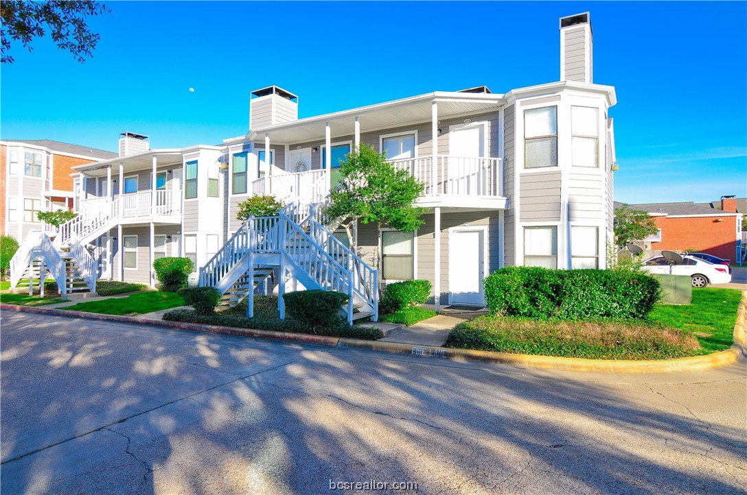 4441 Old College Road, Unit 4104 Bryan, TX 77801 - Photo 1 of 1 a front view of a building with a garden
