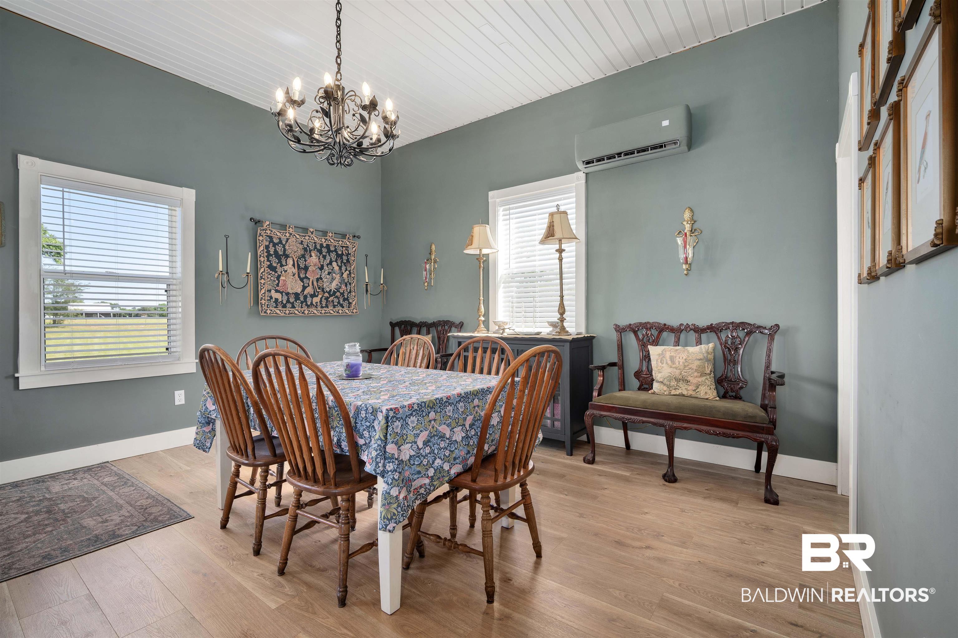 22 Horace Odom Road Millry, AL 36558 - Photo 15 of 39 Dining room featuring light wood finished floors, a mini split for heating / cooling, and a chandelier