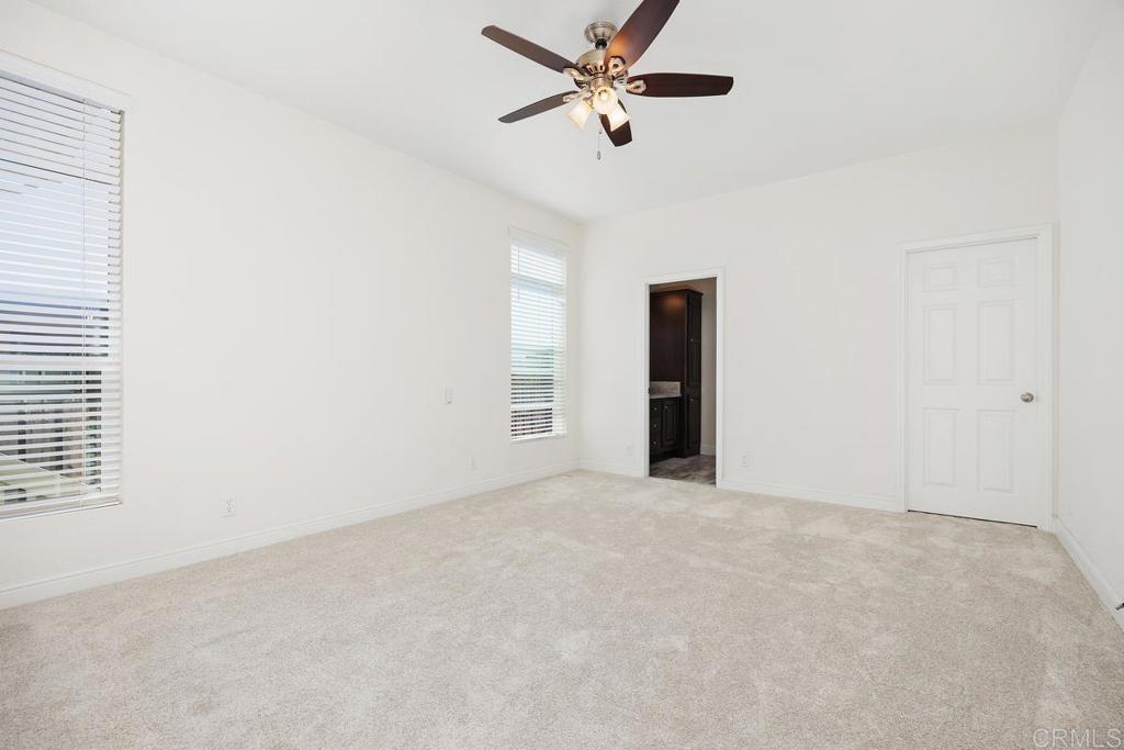 7213 San Luis Street, Unit 171 Carlsbad, CA 92011 - Photo 16 of 44 a view of an empty room with a window