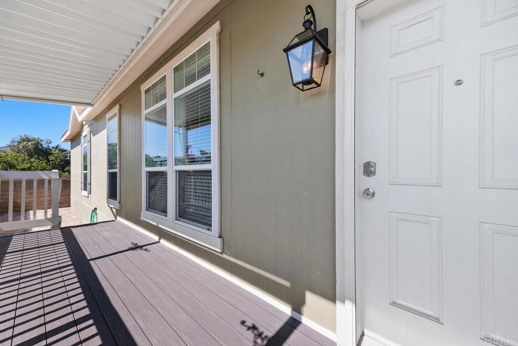 7213 San Luis Street, Unit 171 Carlsbad, CA 92011 - Photo 3 of 44 a balcony view with wooden floor