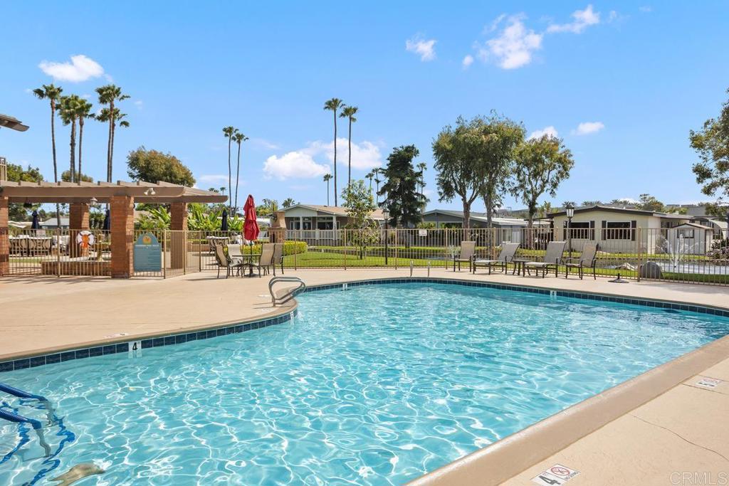 7213 San Luis Street, Unit 171 Carlsbad, CA 92011 - Photo 32 of 44 a view of a swimming pool with an outdoor seating