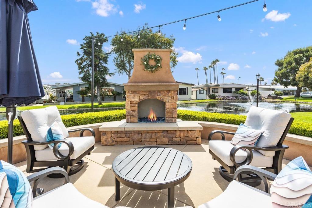 7213 San Luis Street, Unit 171 Carlsbad, CA 92011 - Photo 34 of 44 a view of a chairs and table in the patio