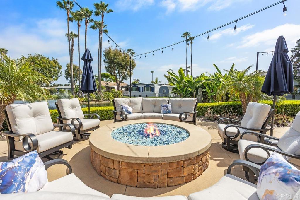 7213 San Luis Street, Unit 171 Carlsbad, CA 92011 - Photo 35 of 44 a view of outdoor sitting area with furniture and wooden floor