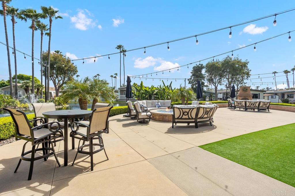 7213 San Luis Street, Unit 171 Carlsbad, CA 92011 - Photo 36 of 44 a view of a patio with a table and chairs