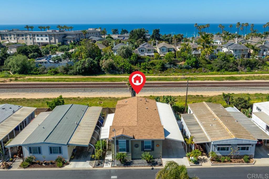 7213 San Luis Street, Unit 171 Carlsbad, CA 92011 - Photo 44 of 44 a view of a big building with swimming pool and lawn chairs