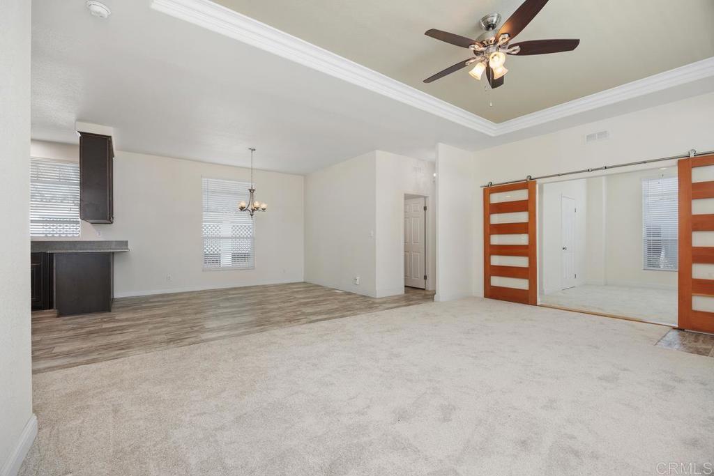 7213 San Luis Street, Unit 171 Carlsbad, CA 92011 - Photo 7 of 44 a view of empty room with ceiling fan