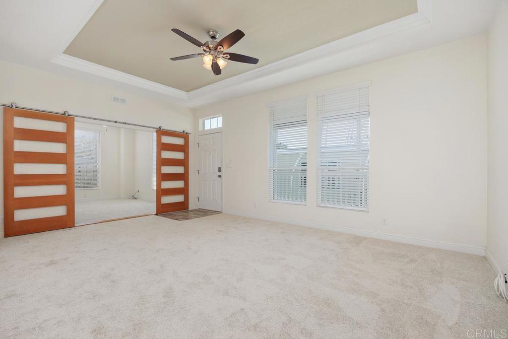 7213 San Luis Street, Unit 171 Carlsbad, CA 92011 - Photo 9 of 44 a view of an empty room with a window