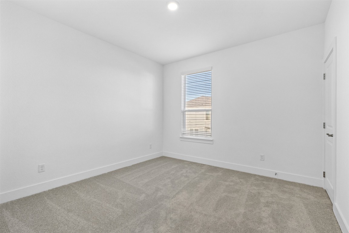 1955 Settlers Glen Drive, Unit 4301 Round Rock, TX 78665 - Photo 10 of 19 an empty room with a window
