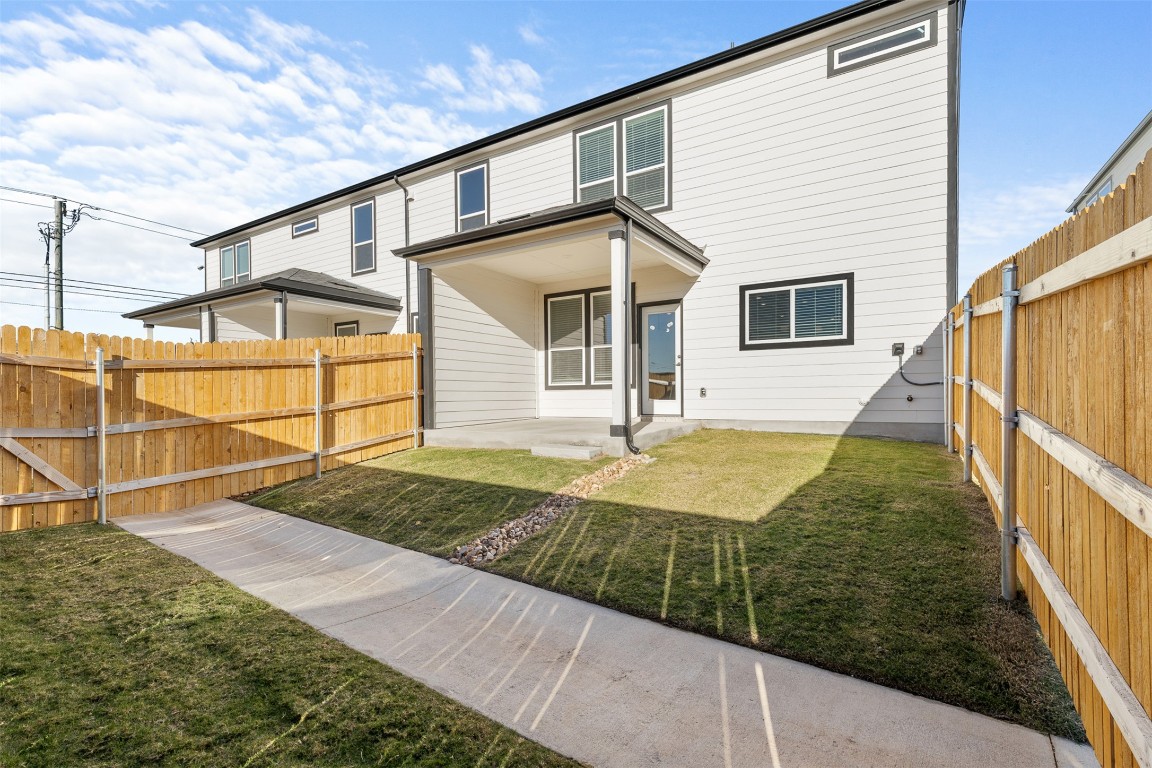 1955 Settlers Glen Drive, Unit 4301 Round Rock, TX 78665 - Photo 18 of 19 a front view of a house with garden
