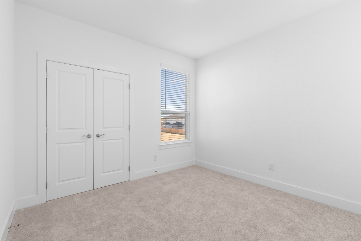 1955 Settlers Glen Drive, Unit 4301 Round Rock, TX 78665 - Photo 8 of 19 an empty room with a window