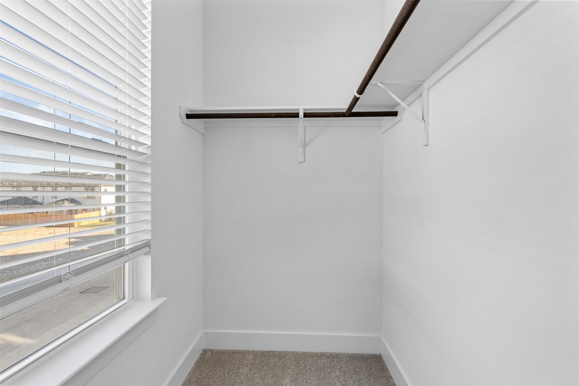 1955 Settlers Glen Drive, Unit 4301 Round Rock, TX 78665 - Photo 9 of 19 a view of an empty walk in closet