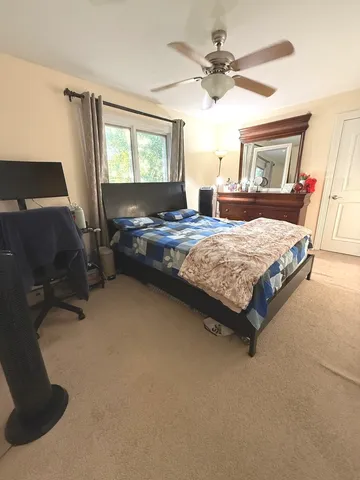 a living room with kitchen furniture and a flat screen tv