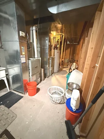 a dining room with a table and chairs