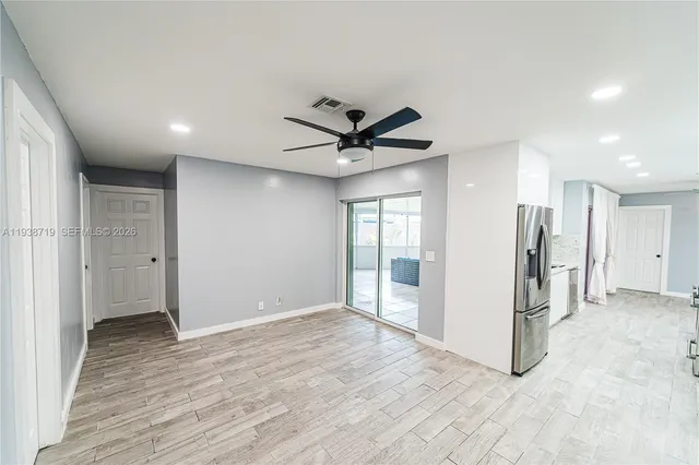 a bathroom with a sink vanity granite and a mirror