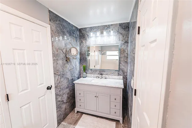 a bathroom with a toilet a sink and a shower