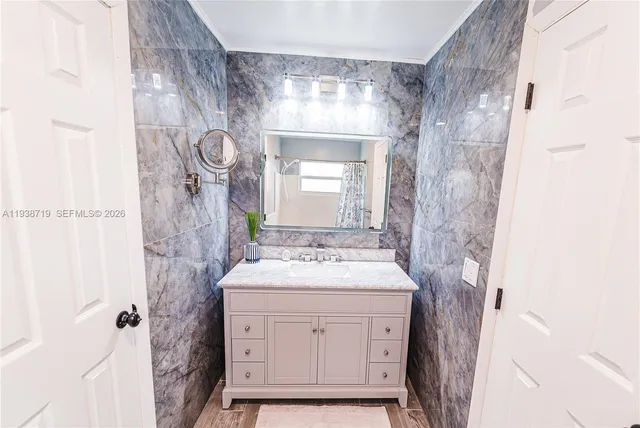 an empty room with closet and windows