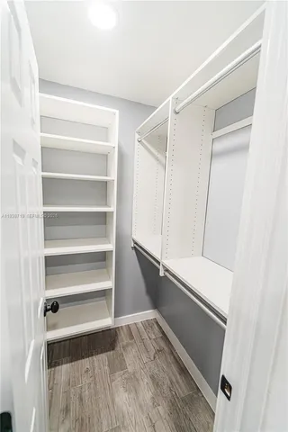 a view of a patio with table and chairs