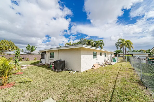 a view of street along with house and trees