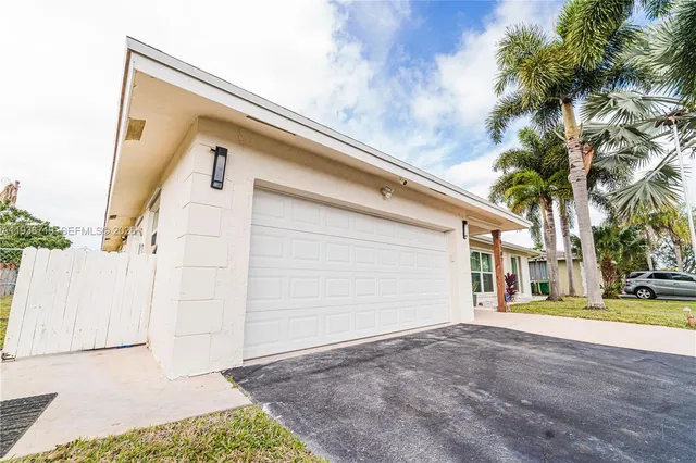 a view of a swimming pool with an outdoor seating