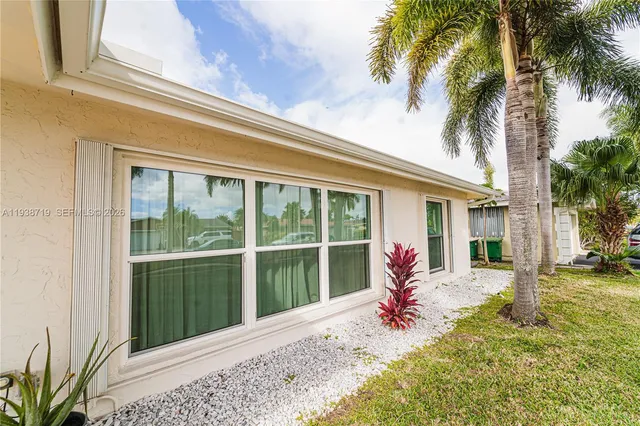 a view of a swimming pool with an outdoor seating